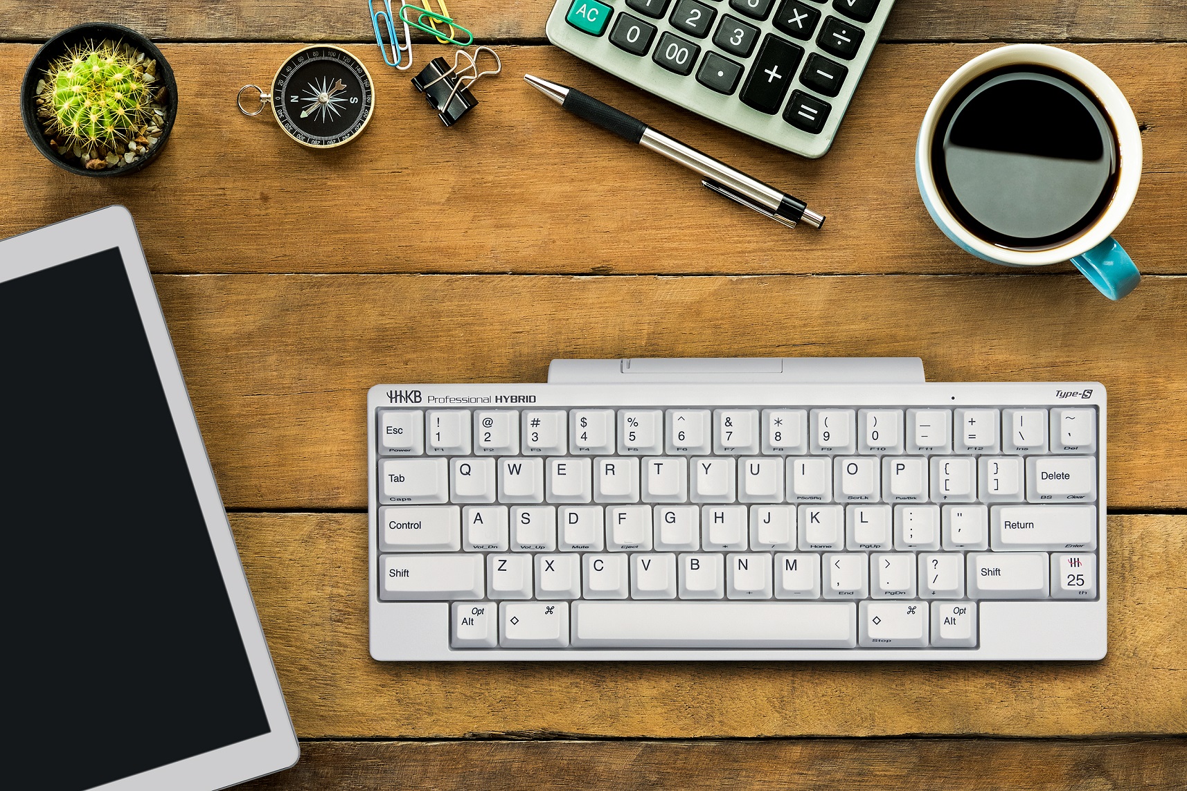 Office workspace with blank screen tablet, blank screen smart phone,coffee cup ,pencil ,calculator and compass.Top view with copy space.Workspace with office supplies.Working desk table.Flat lay. ; Shutterstock ID 422711626; purchase_order: -; job: -; client: -; other: -